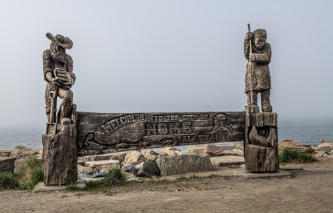 carved wooden sign in nome alaska